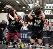 "Battle for Middle Ground athletes utilizing the durable 2-Person Worm to master lifts, carries, and team movements."