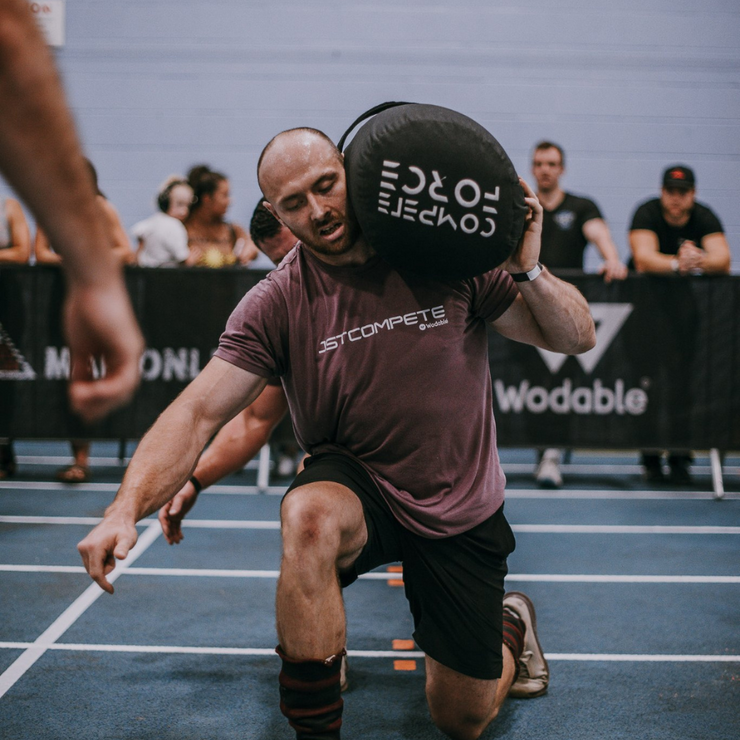 "Battle for Middle Ground gym members preparing with the 2-Person Worm, building strength and unity through challenging drills."